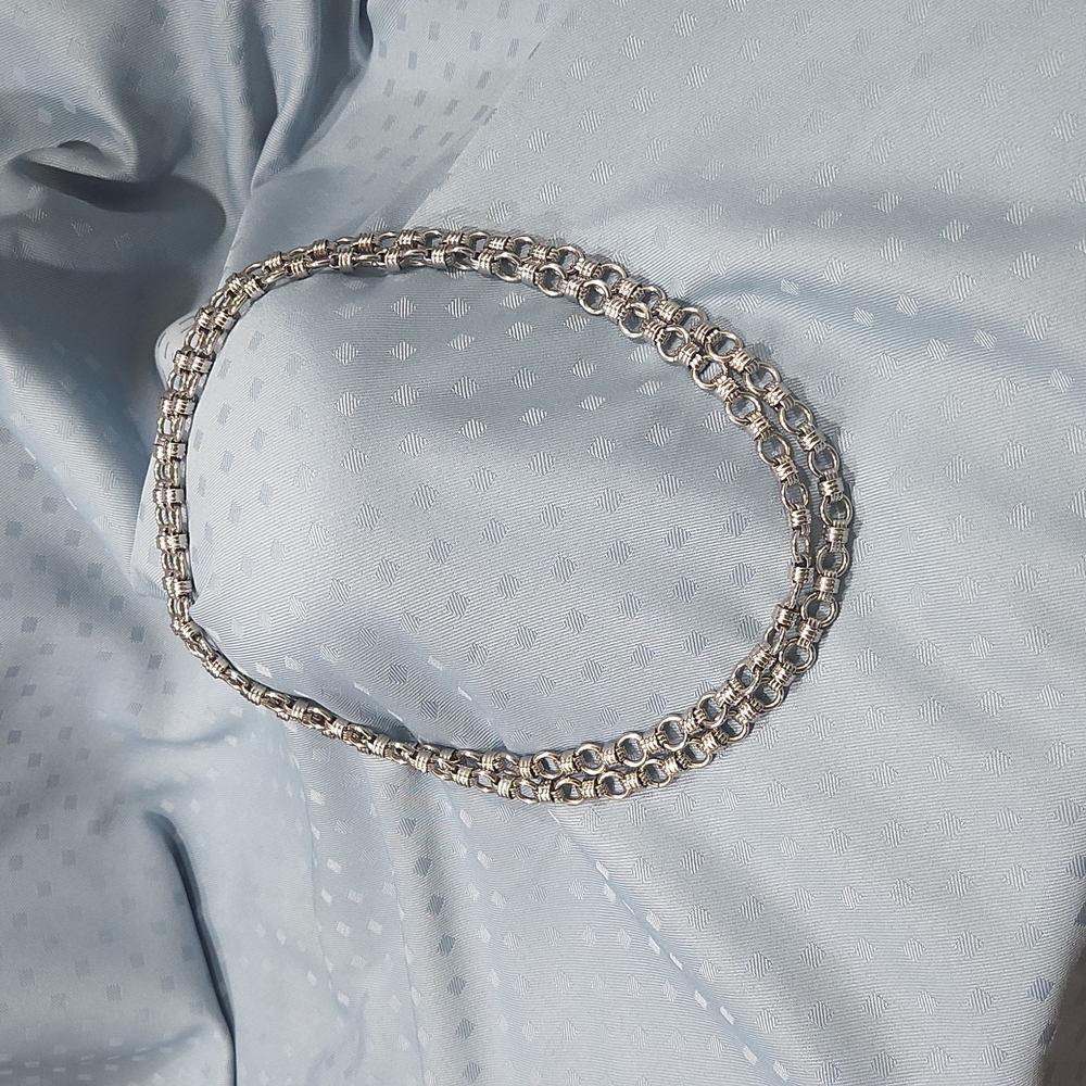 Necklace. Silver-tone infinity knot design